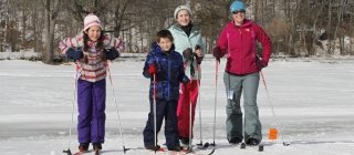 Family and friends cross-country skiing at Snow Days event
